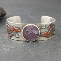 Silver Cuff with Fluroite, Coyotes, Wolves, Stars front