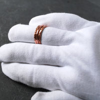 Hammered Copper Stacking Rings on finger