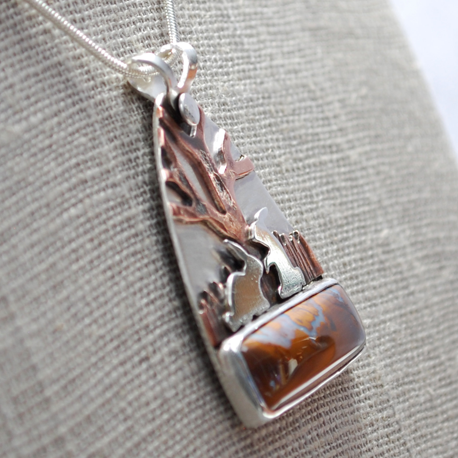 Boulder Opal Pendant with Rabbits, Tree closeup angle