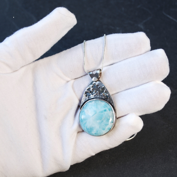 Silver Larimar pendant in hand