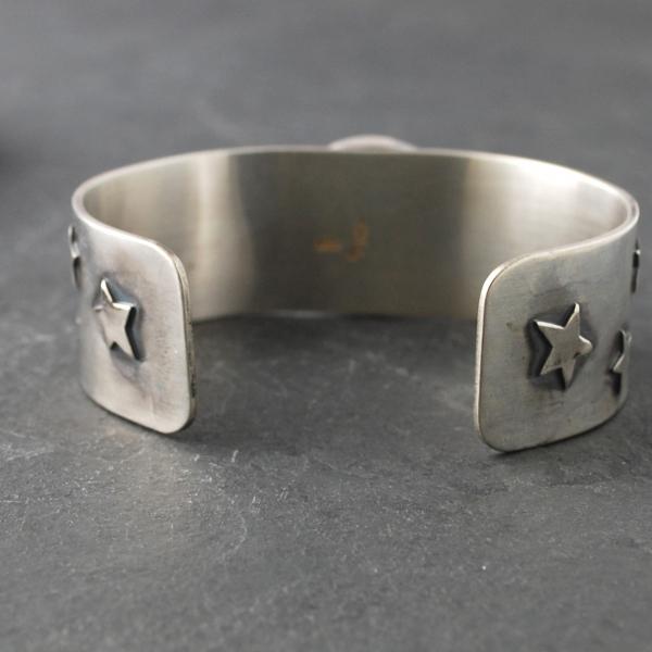 Silver Cuff with Fluroite, Coyotes, Wolves, Stars inside