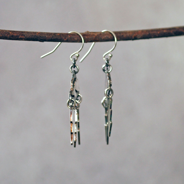 Silver Cloud Earrings with Lightning Bolts, hanging side view
