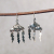 Silver Cloud Earrings with Lightning Bolts, hanging