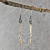 Silver Cloud Earrings with Rain, Lightning hanging, angle view