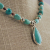 Nacozari Turquoise, Silver, Copper Necklace, pendant close-up at angle