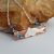 Hammered Bronze Bar Necklace with Happy Silver Fish and Blue Topaz