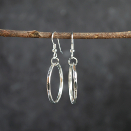 Silver Hoop Earrings hanging as worn