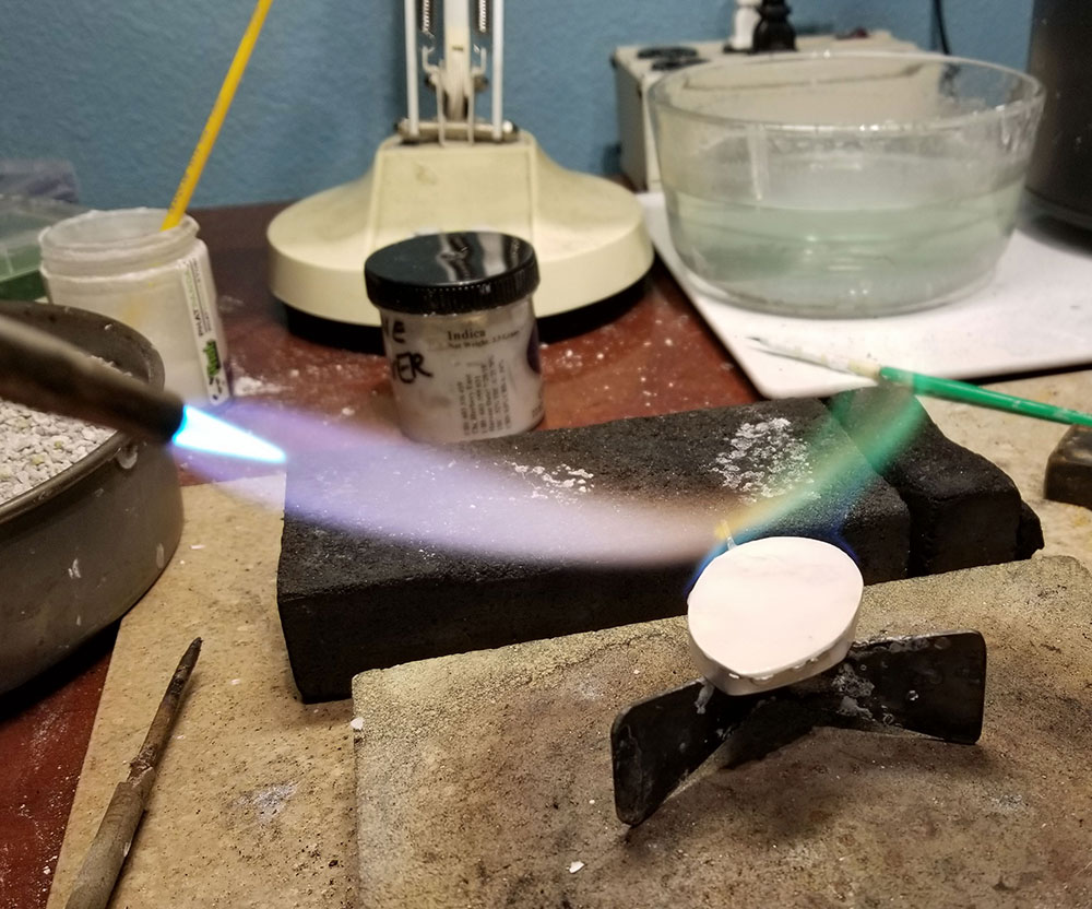 torch flame on piece of metal