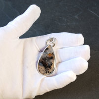 Marfa Plume Agate Pendant in hand