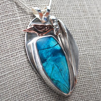 Chrysocolla Pendant with Bird and Cattail close-up angle