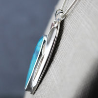 Chrysocolla Pendant with Bird and Cattail close-up angle