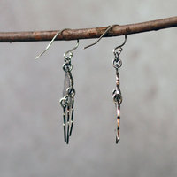 Silver Cloud Earrings with Lightning Bolts, hanging side view