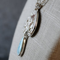 Larimar Pendant, Silver Waves, Dolphin, close up angle