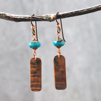 Earrings with corrugated copper rectangle dangles and turquoise Czech glass bead on top, hanging
