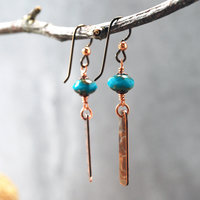Earrings with corrugated copper rectangle dangles and turquoise Czech glass bead on top, hanging