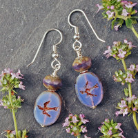 Pale purple Czech glass earrings, swallow embossed flat beads at bottom, topped by faceted rondelle beads