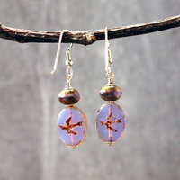 Pale purple Czech glass earrings, swallow embossed flat beads at bottom, topped by faceted rondelle beads, hanging