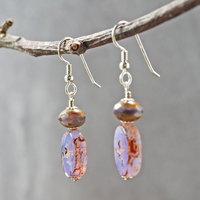 Pale purple Czech glass earrings, swallow embossed flat beads at bottom, topped by faceted rondelle beads, hanging