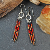 Silver earrings with red, brown, black dangles