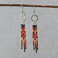 Silver earrings with red, brown, black dangles