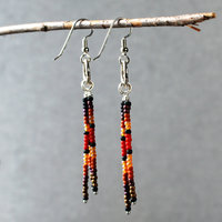 Silver earrings with red, brown, black dangles