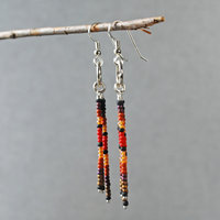 Silver earrings with red, brown, black dangles