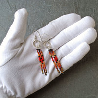 Silver earrings with red, brown, black dangles