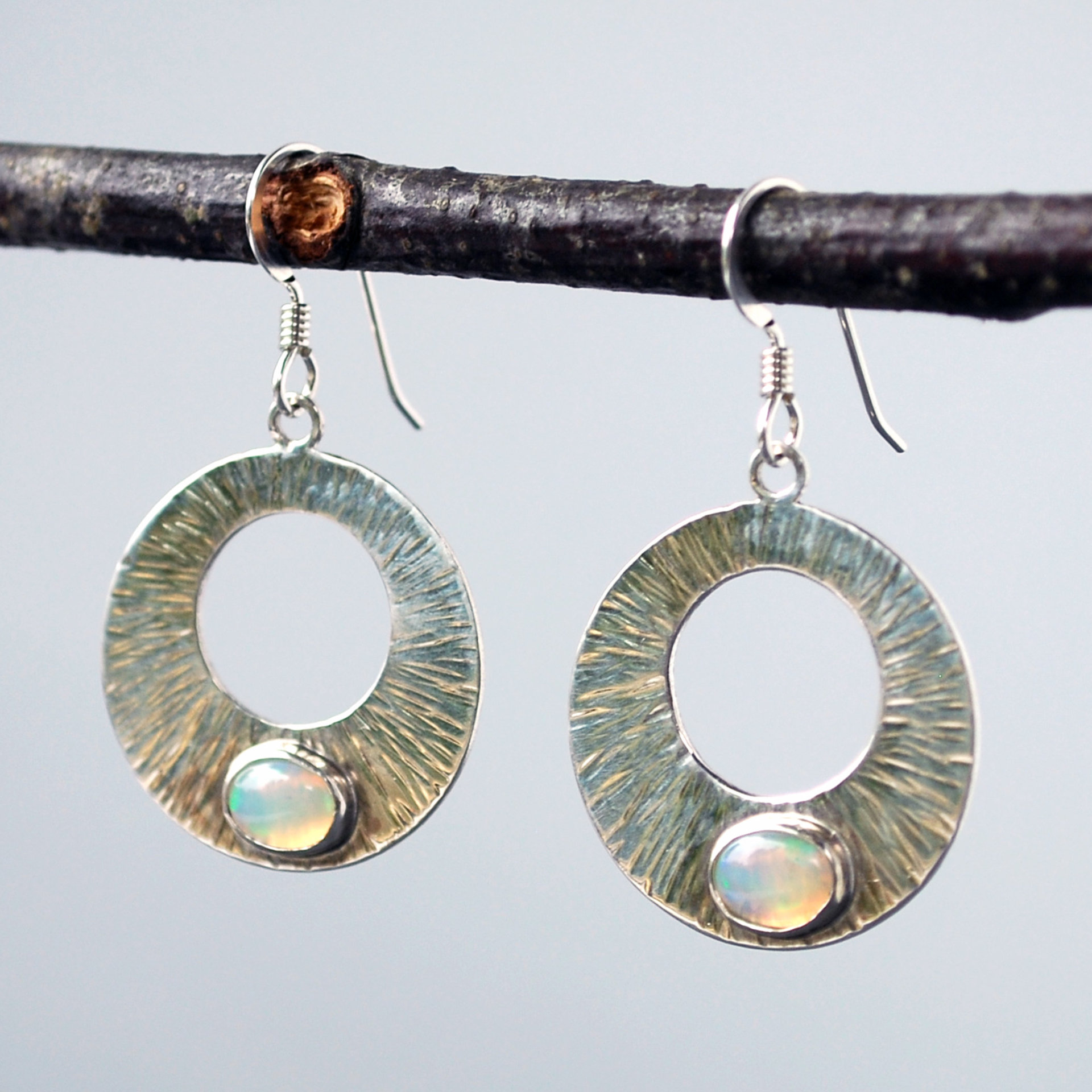 Silver Circle Earrings with Welo Opals hanging