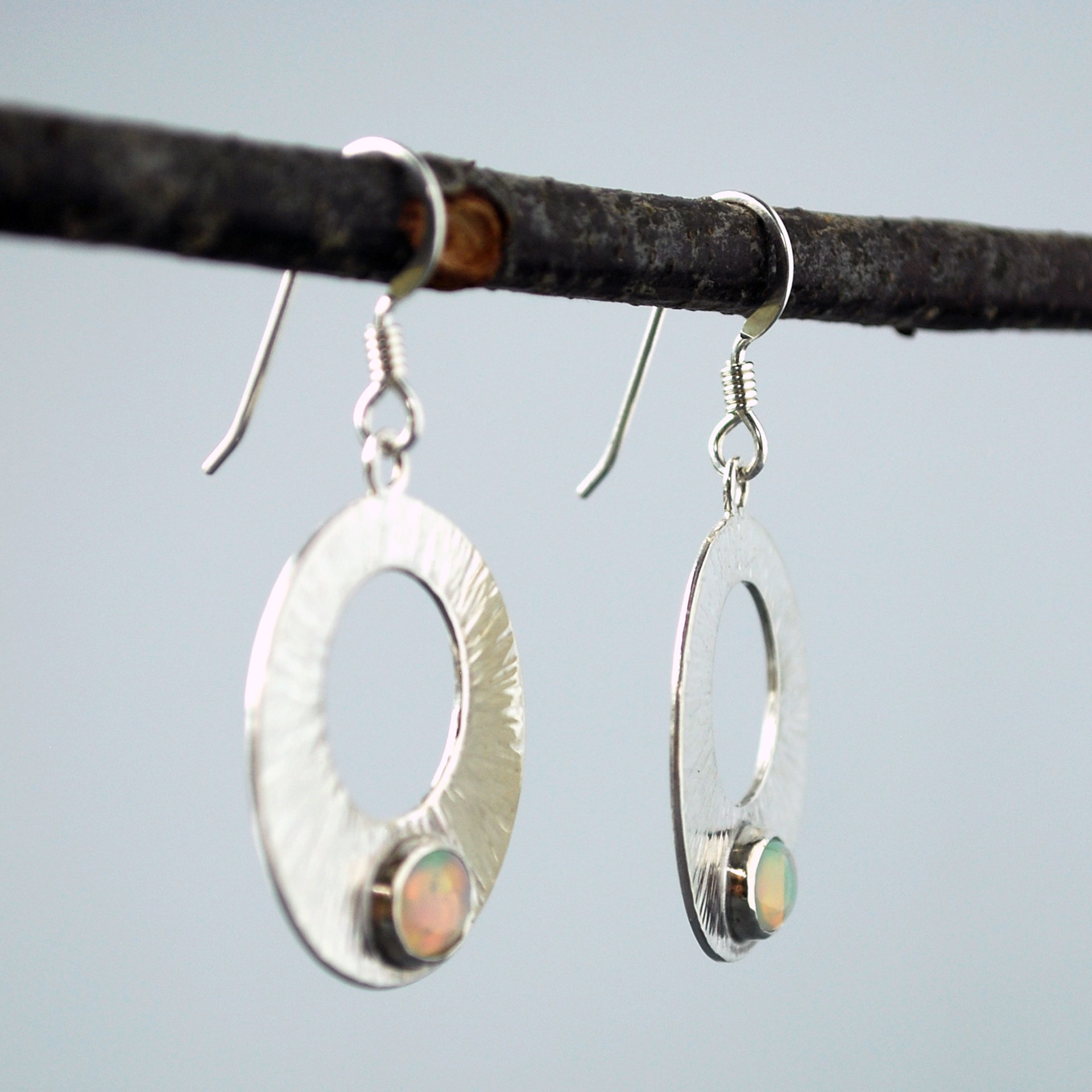Silver Circle Earrings with Welo Opals hanging