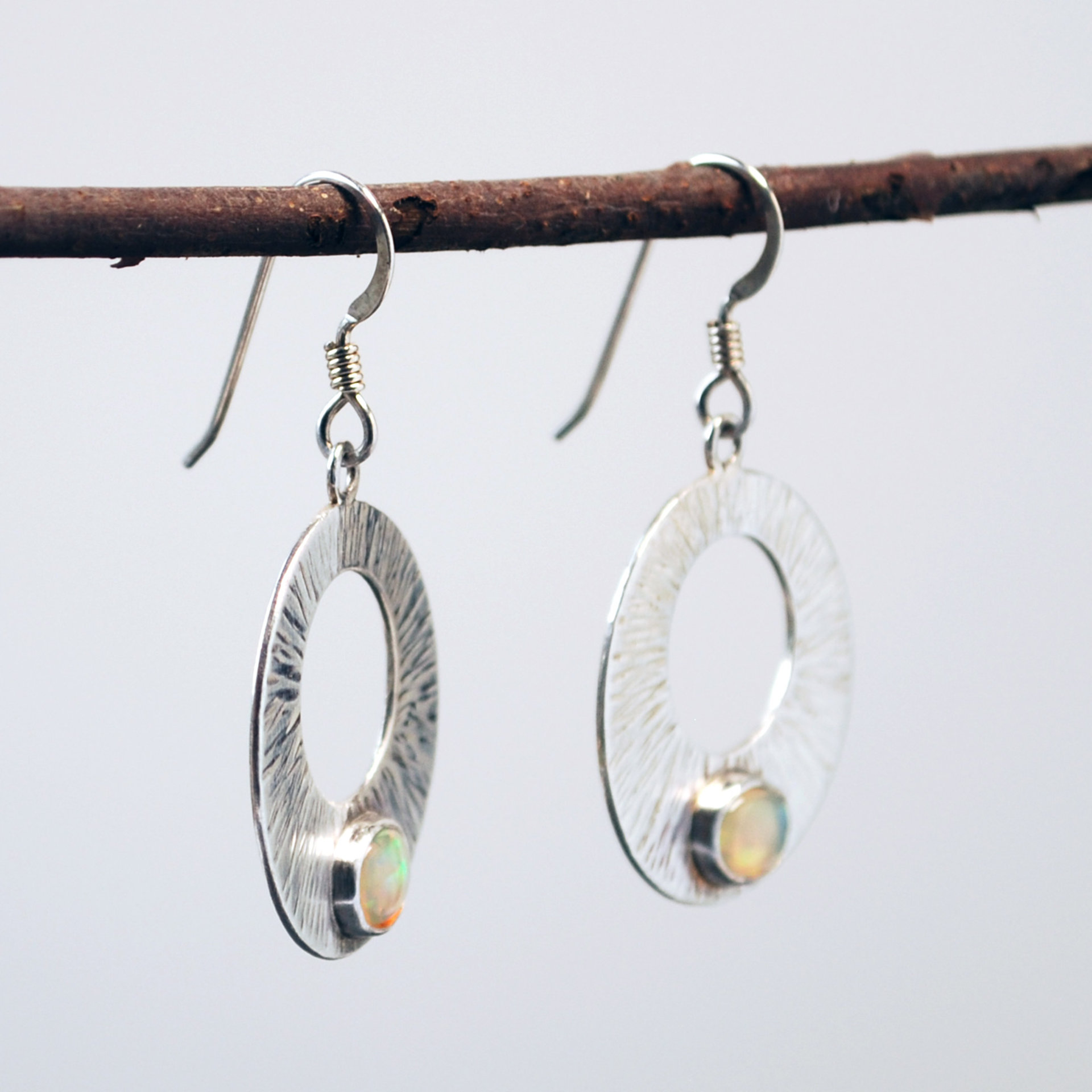 Silver Circle Earrings with Welo Opals hanging