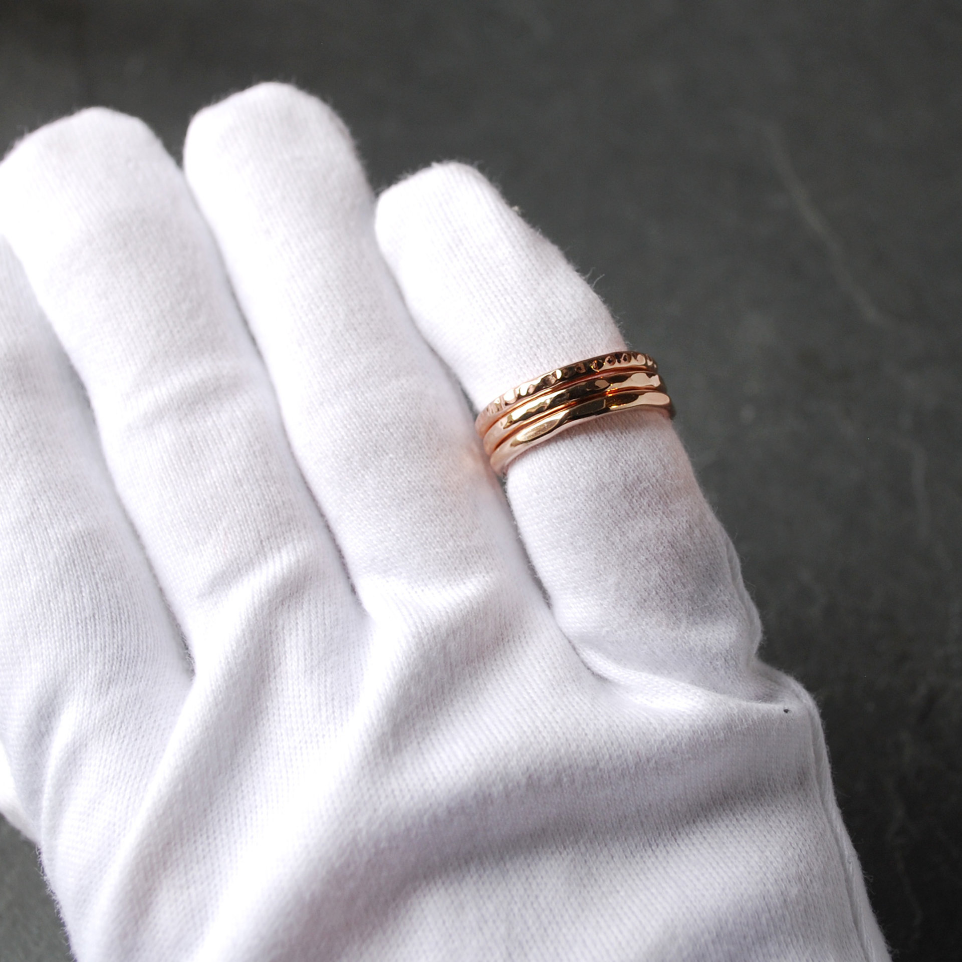 Hammered Bronze Stacking Rings on finger