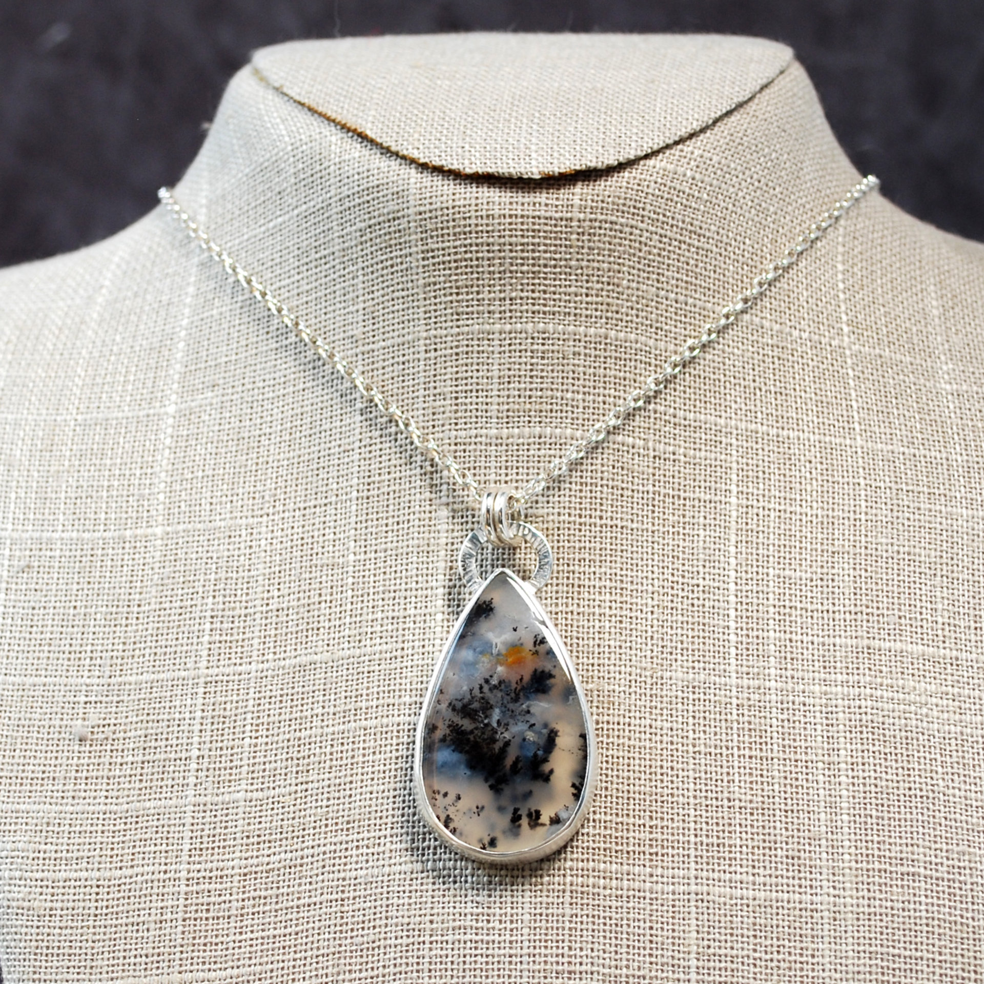 Marfa Plume Agate Pendant hanging as worn
