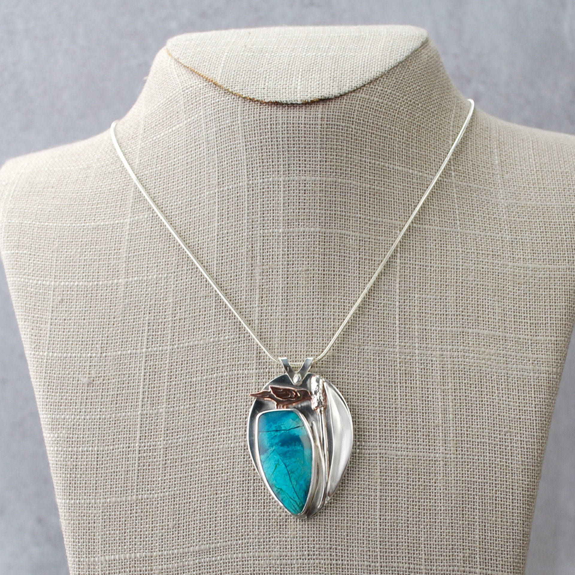 Chrysocolla Pendant with Bird and Cattail hanging