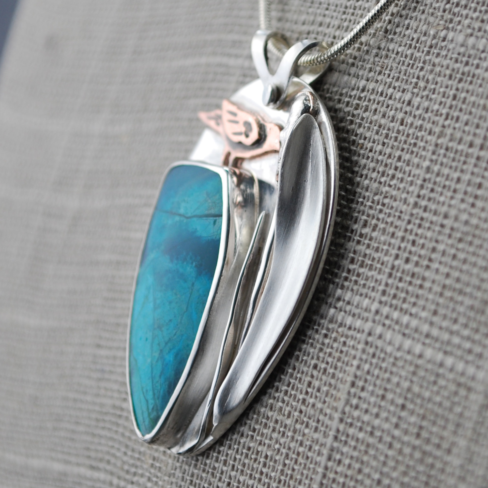 Chrysocolla Pendant with Bird and Cattail close-up angle