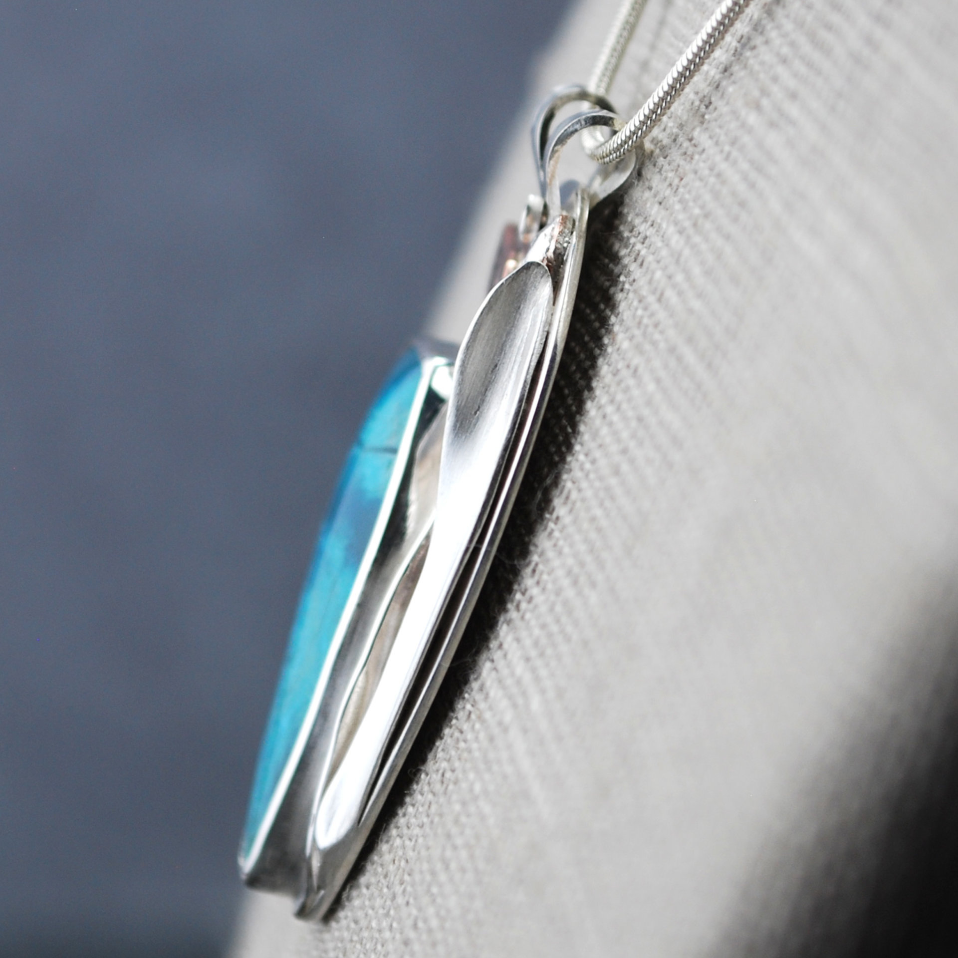 Chrysocolla Pendant with Bird and Cattail close-up angle