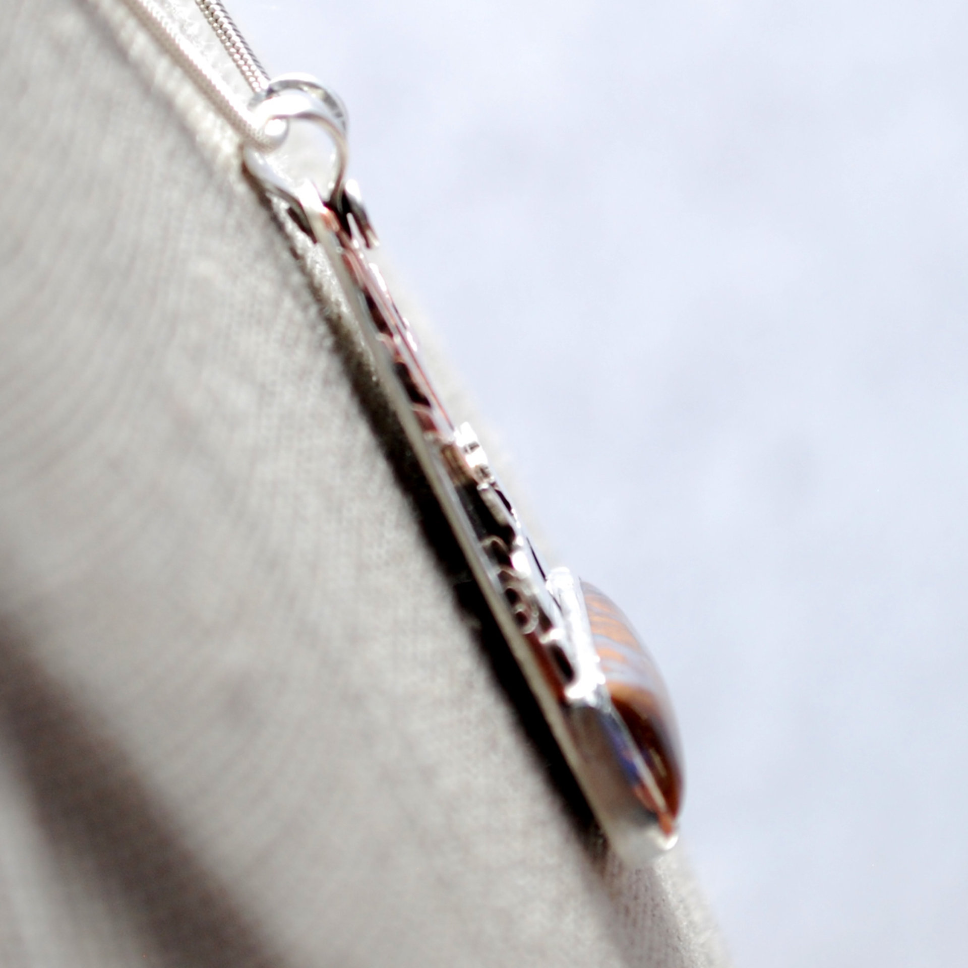 Boulder Opal Pendant with Rabbits, Tree closeup angle