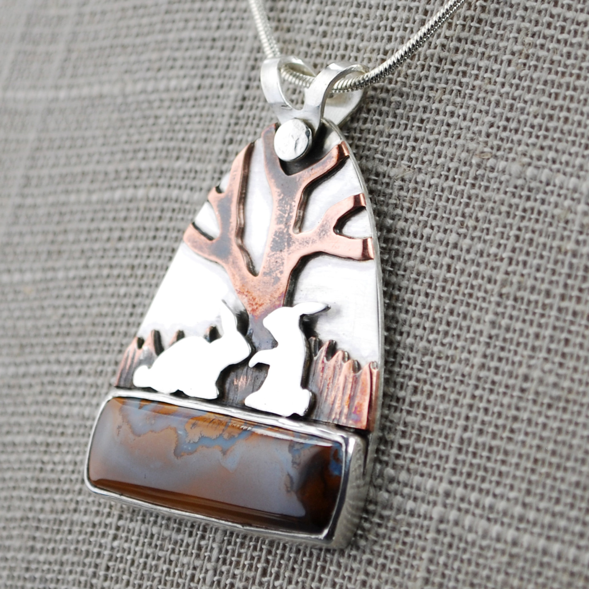Boulder Opal Pendant with Rabbits, Tree closeup angle