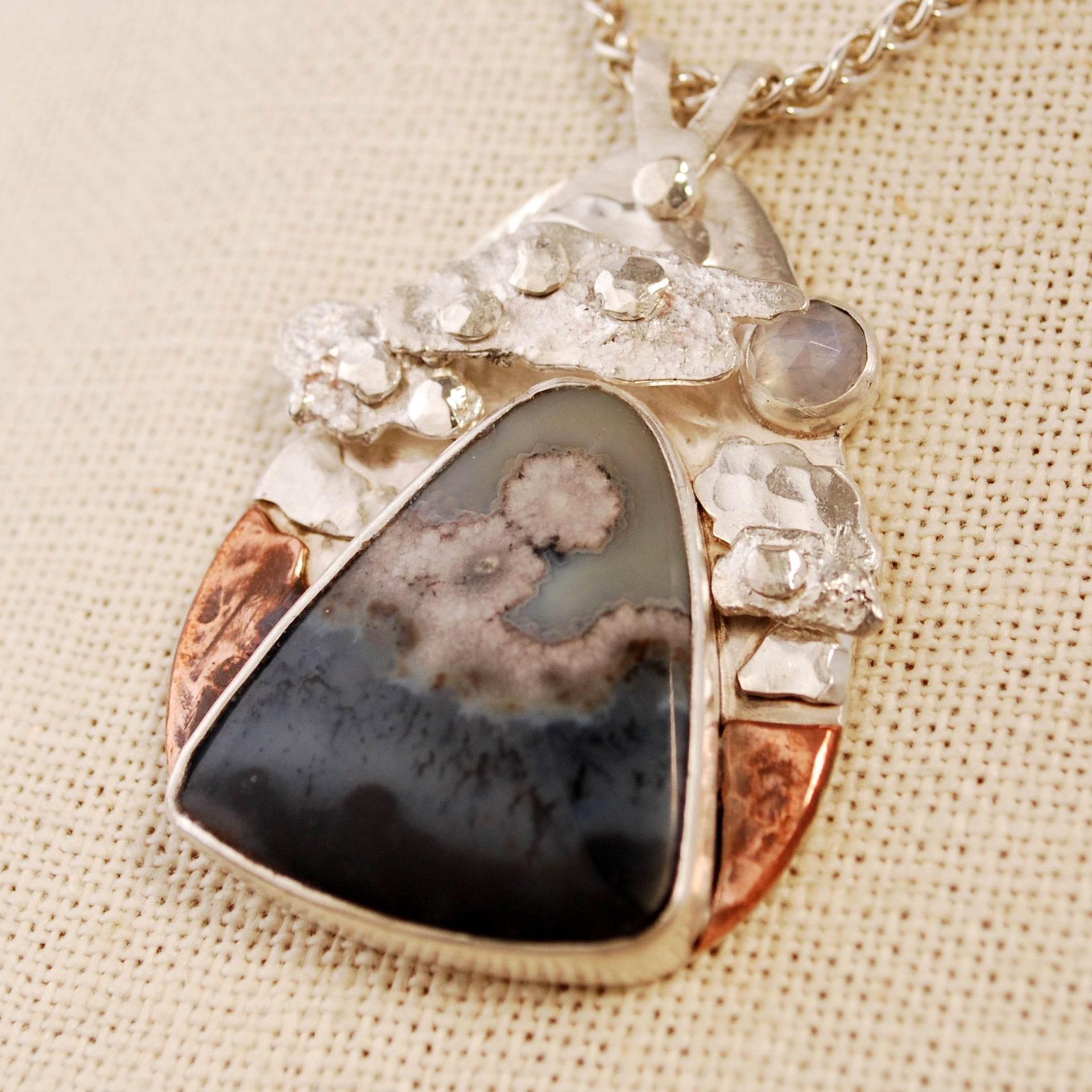 Silver Agate Pendant, Riveted Clouds closeup angle