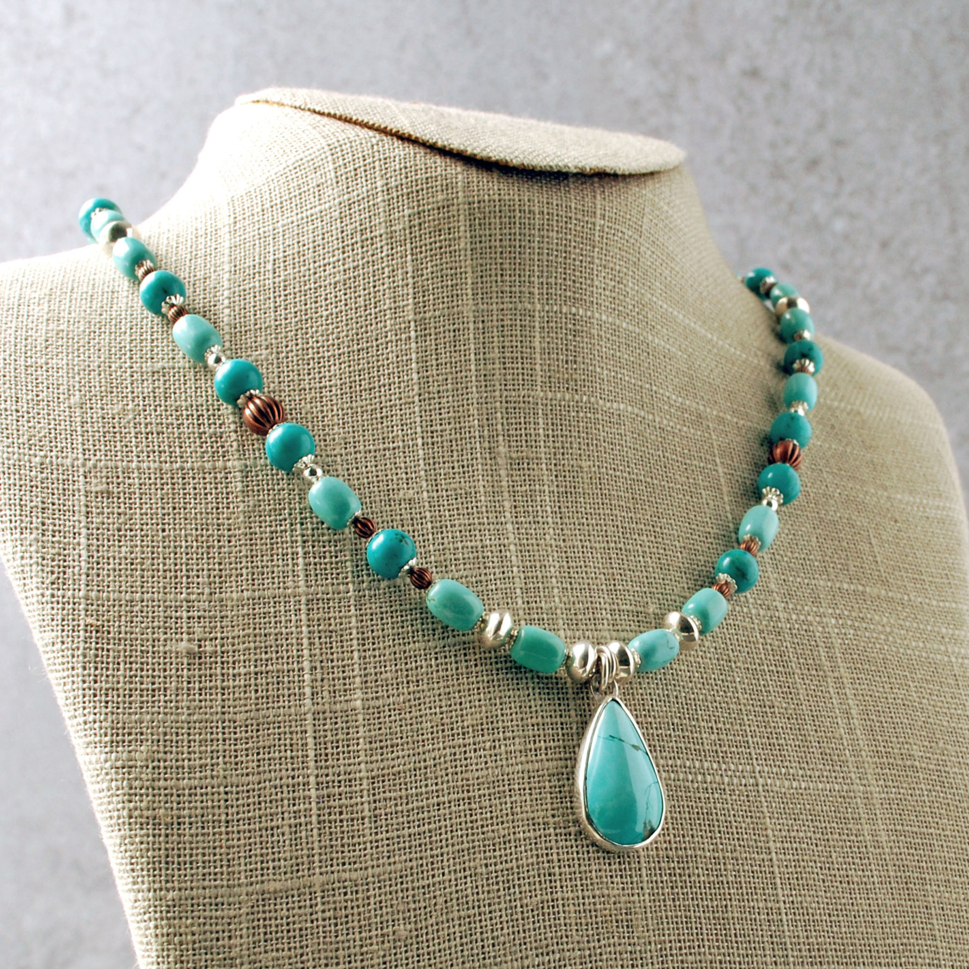 Nacozari Turquoise, Silver, Copper Necklace hanging at angle