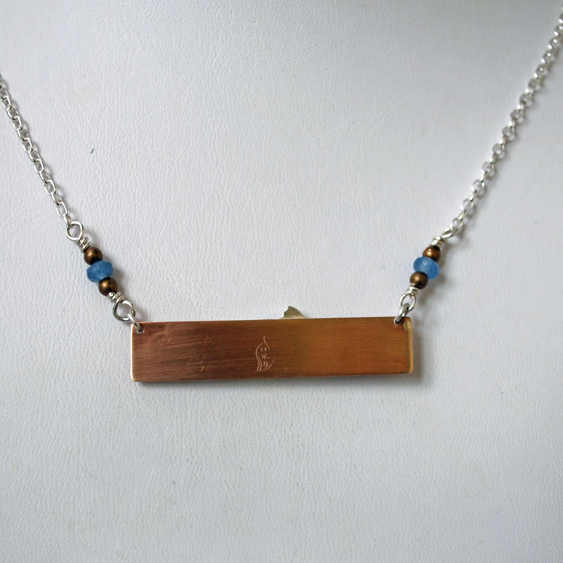 Hammered Bronze Bar Necklace with Happy Silver Fish and Blue Topaz