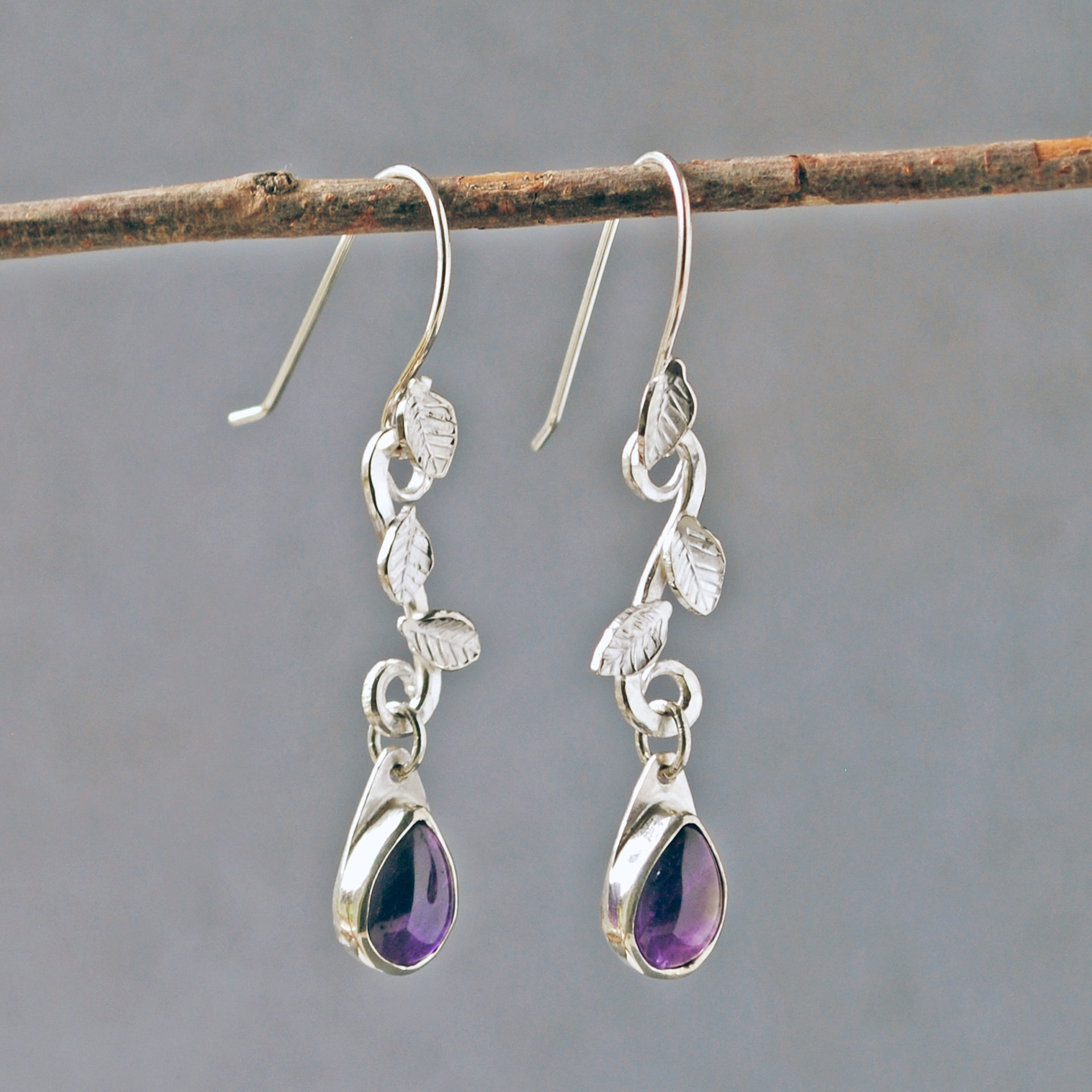 Amethyst Drop Earrings with Silver Leaves, hanging side view
