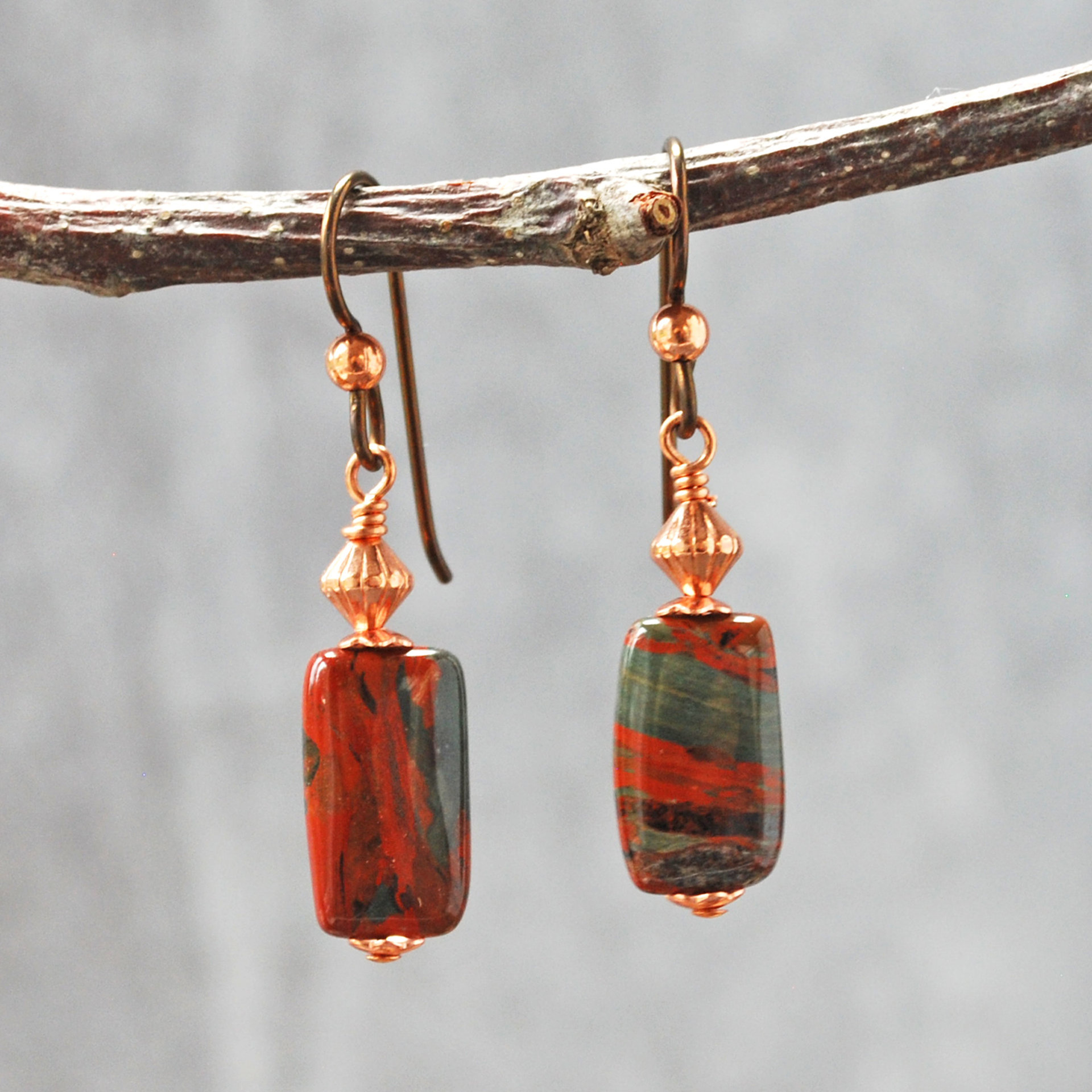Dangling earrings with flame jasper and copper beads hanging