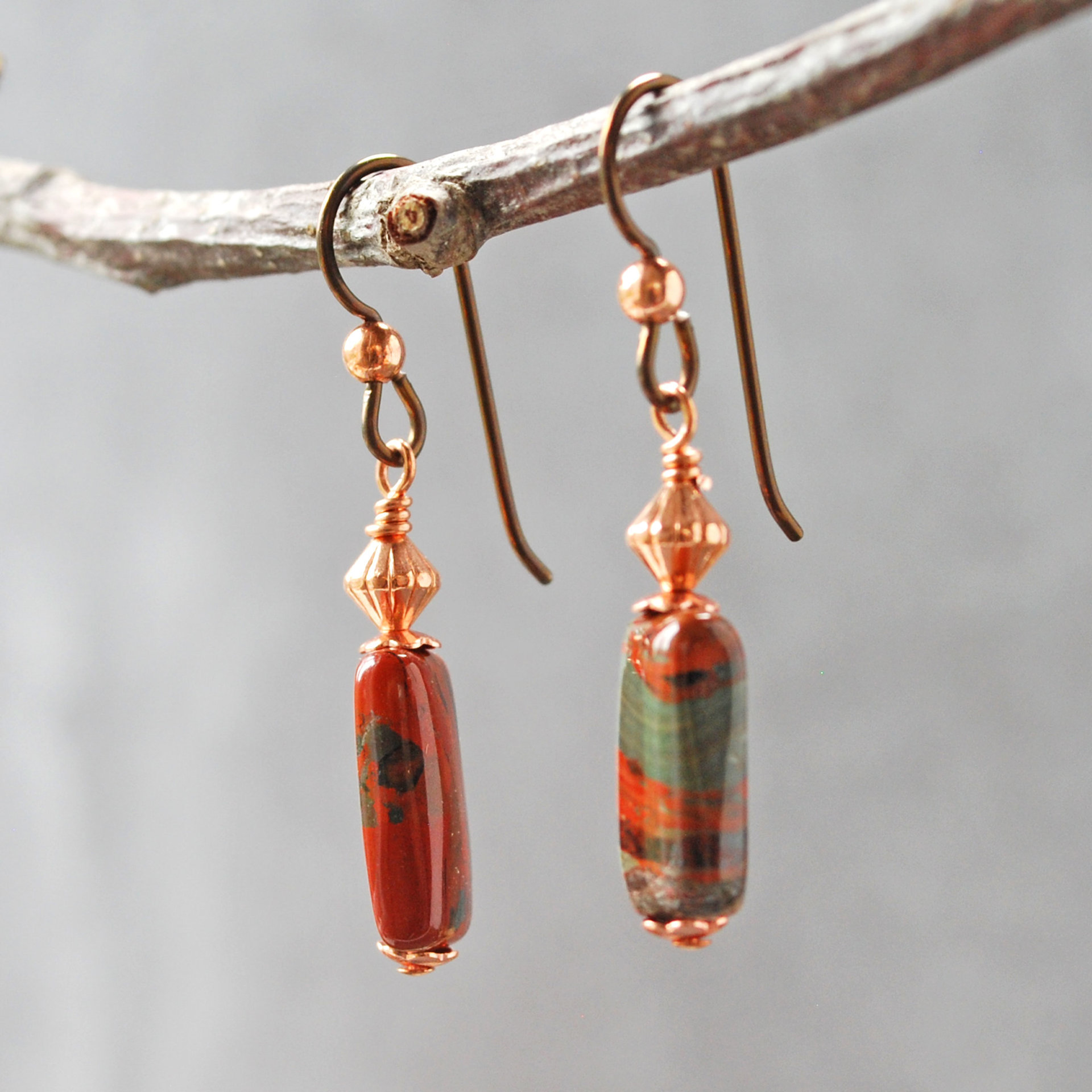 Dangling earrings with flame jasper and copper beads hanging