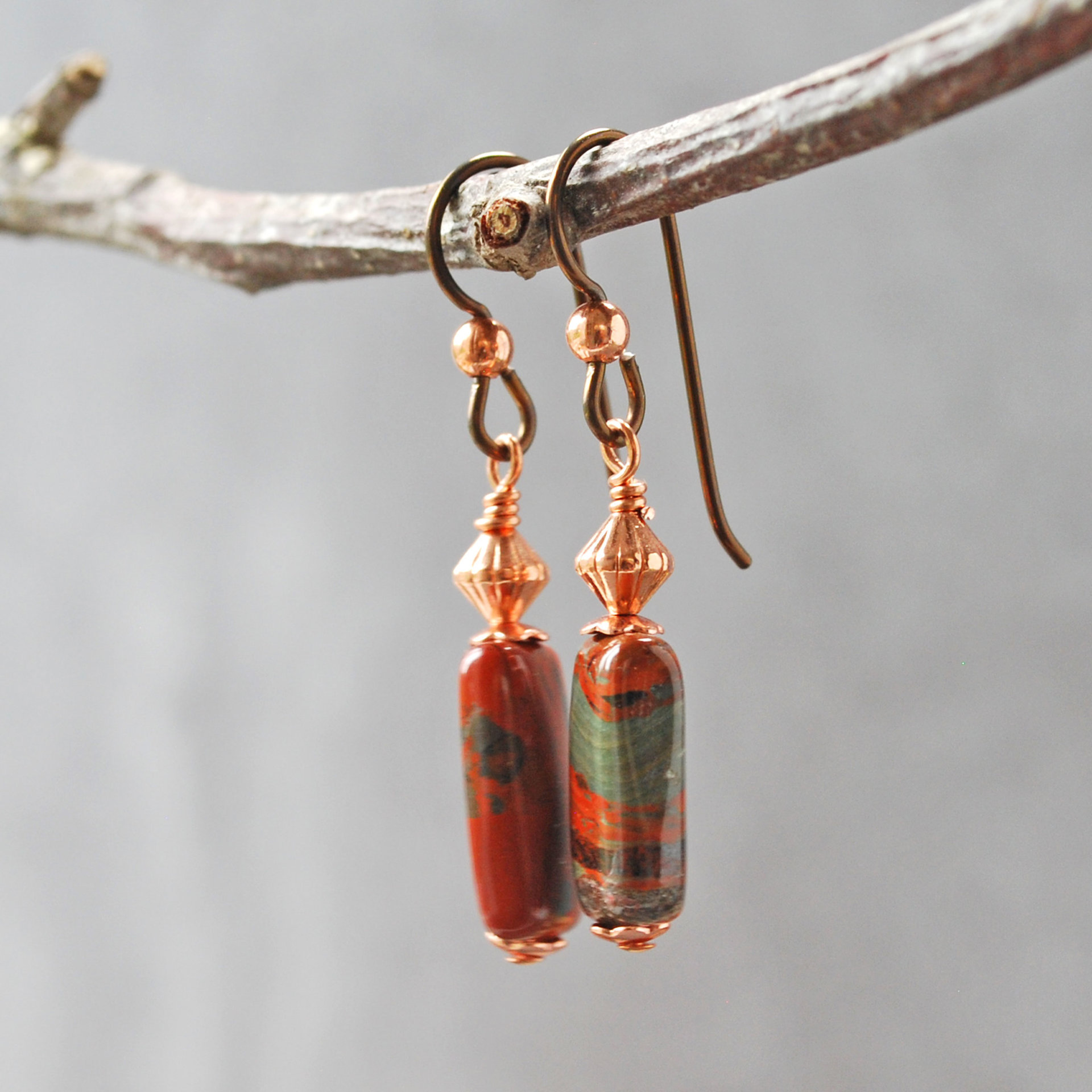 Dangling earrings with flame jasper and copper beads hanging