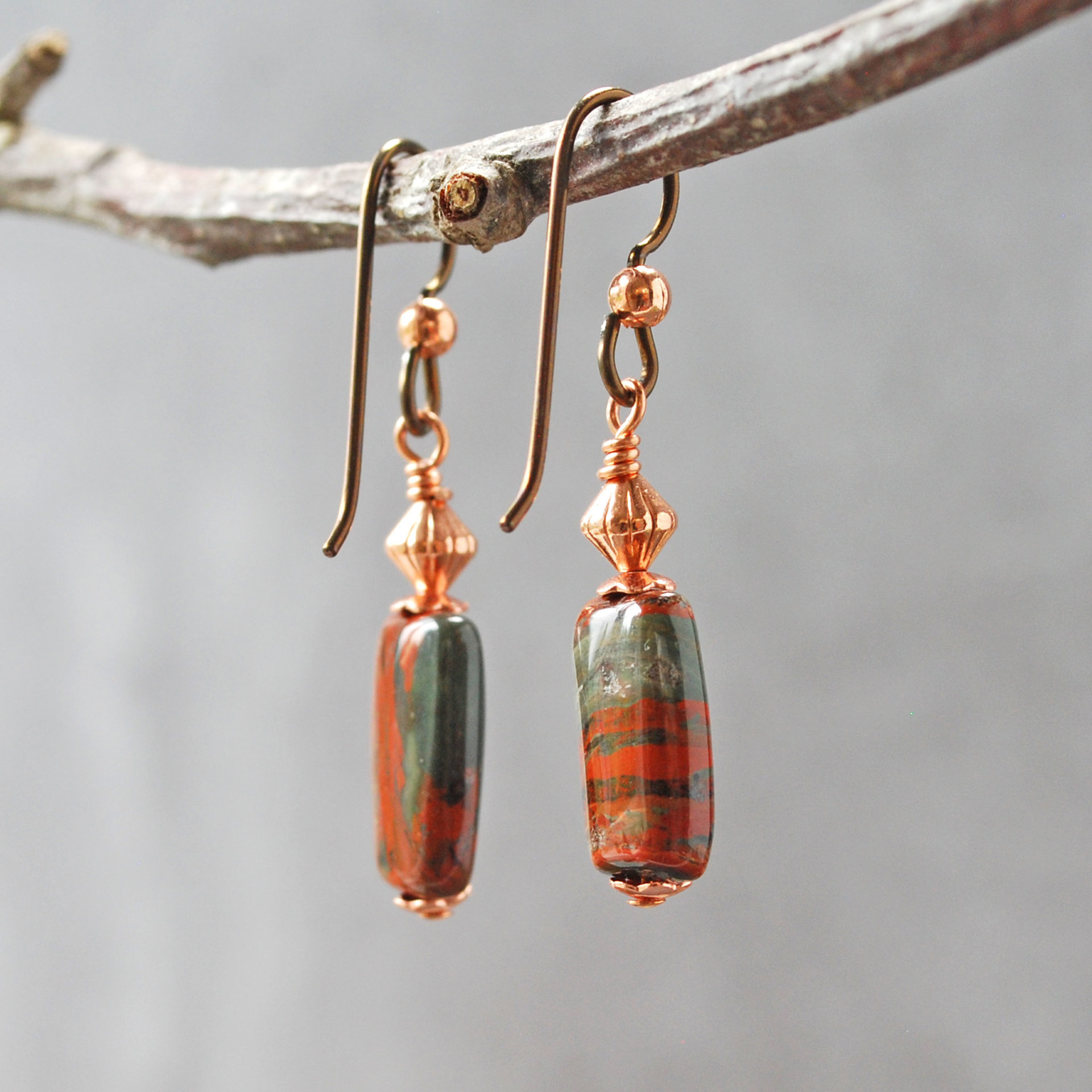 Dangling earrings with flame jasper and copper beads hanging