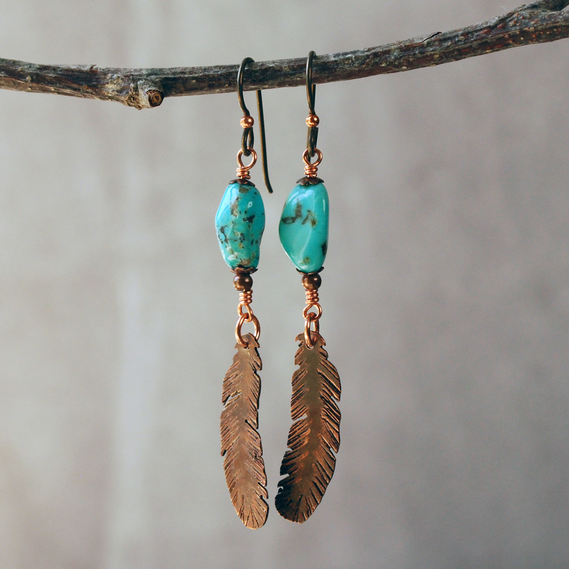 Turquoise earrings with copper feathers