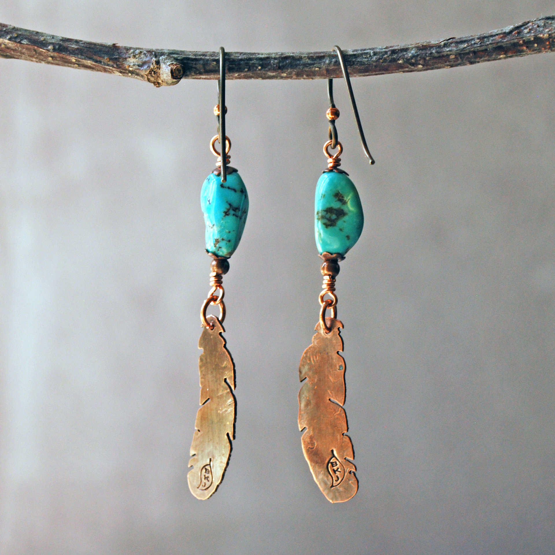 Turquoise earrings with copper feathers