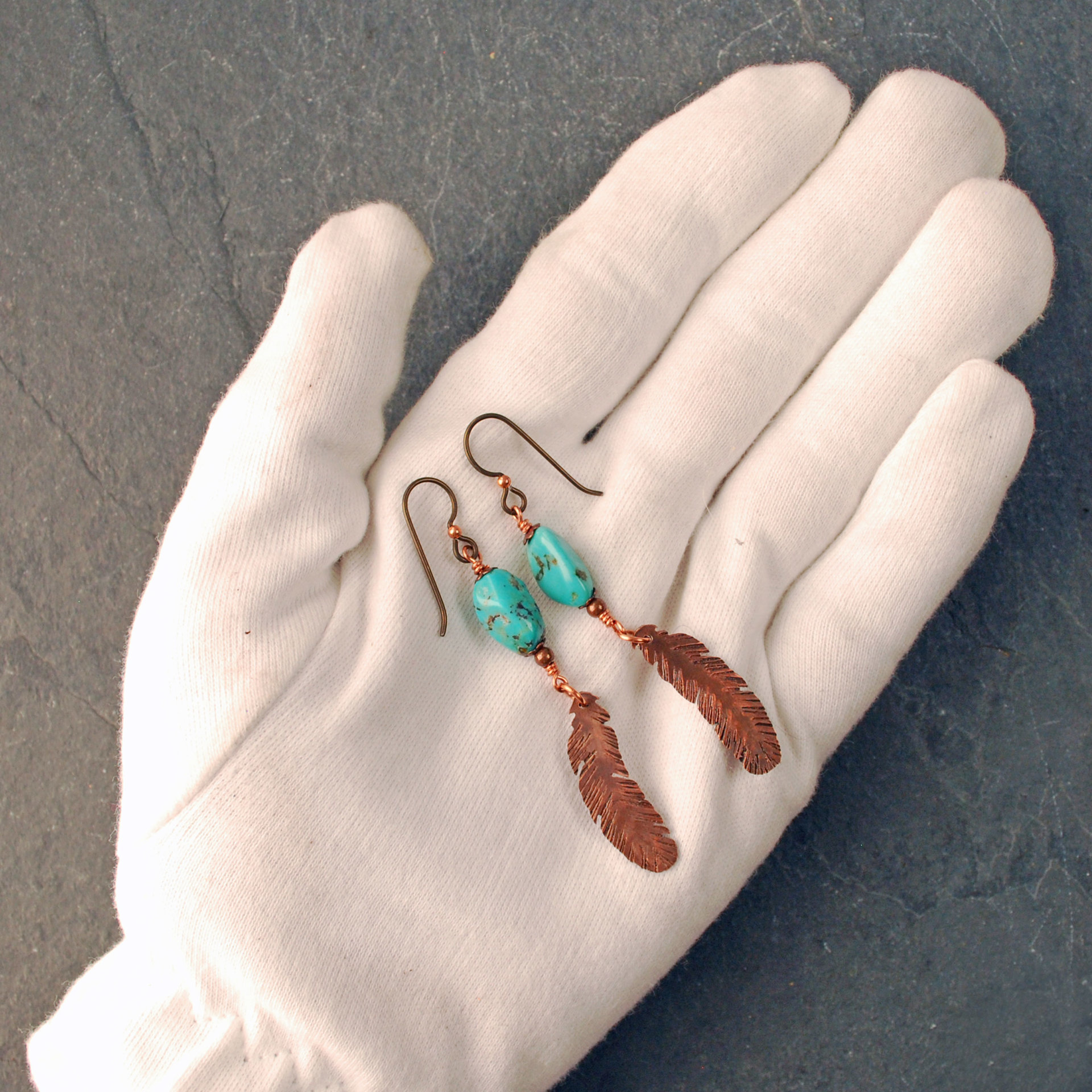 Turquoise earrings with copper feathers