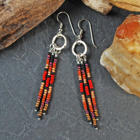 Silver earrings with red, brown, black dangles