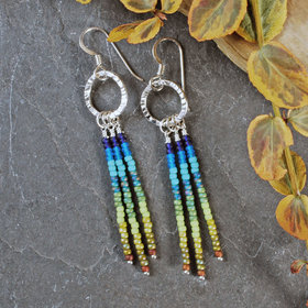 Silver earrings with blue and green dangles